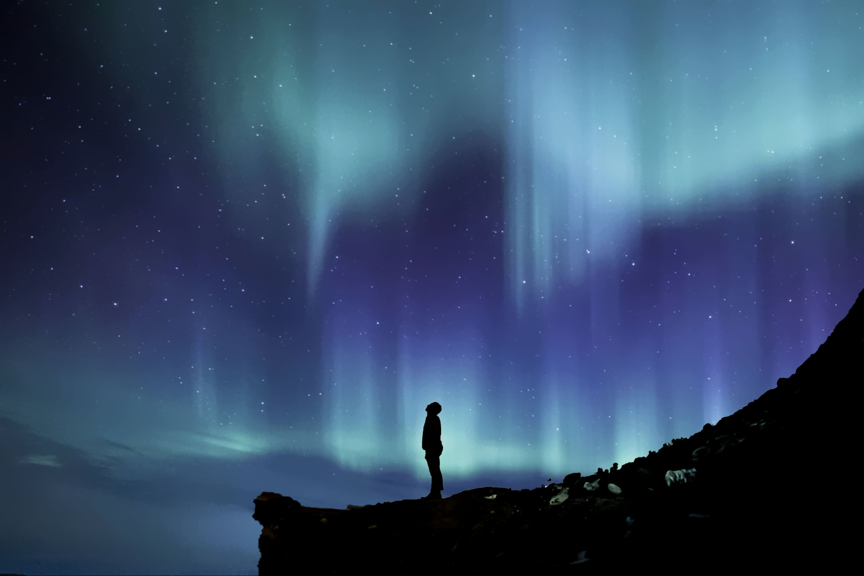Man Looking at Northern Lights
